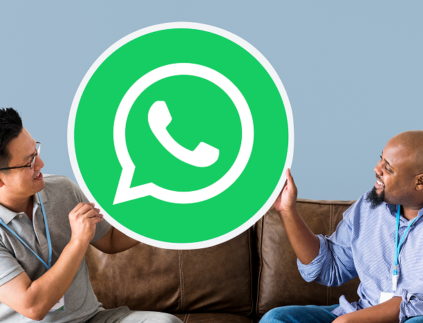 men-showing-whatsapp-messenger-icon